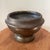 This vintage footed tarnished brass bowl or planter with a rounded flared rim is a unique and decorative collectible for...