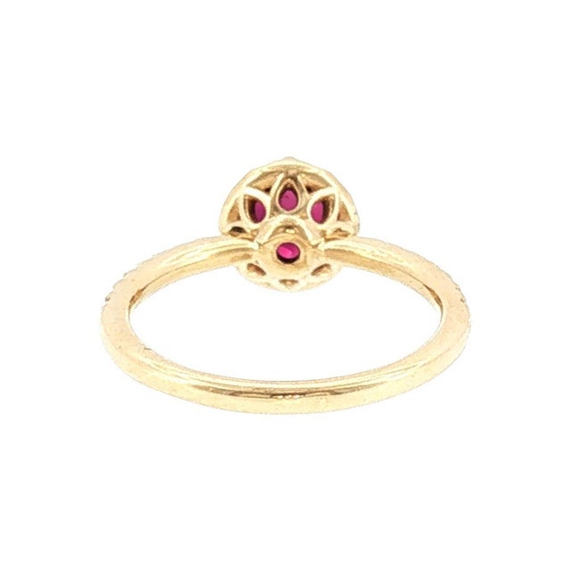 A 21st-century vintage-style engagement ring. The piece features a 1.23-carat round-cut natural ruby with a rich red hue....