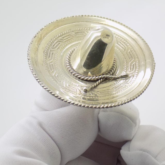 A vintage miniature depicting a traditional Mexican sombrero, handcrafted in sterling silver (925) in Mexico between the...