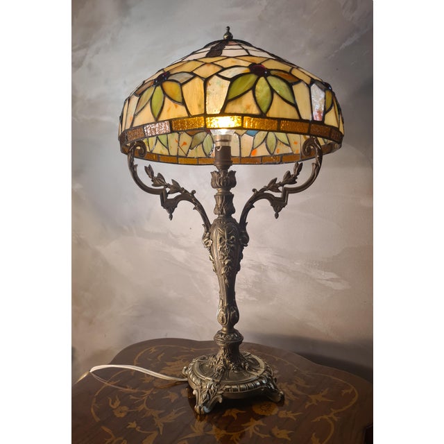 Antique Rocaille Bronze Lamp with Leaded Glass Lampshade in the style of Tiffany, 1880, in Very Good conditions. Designed...