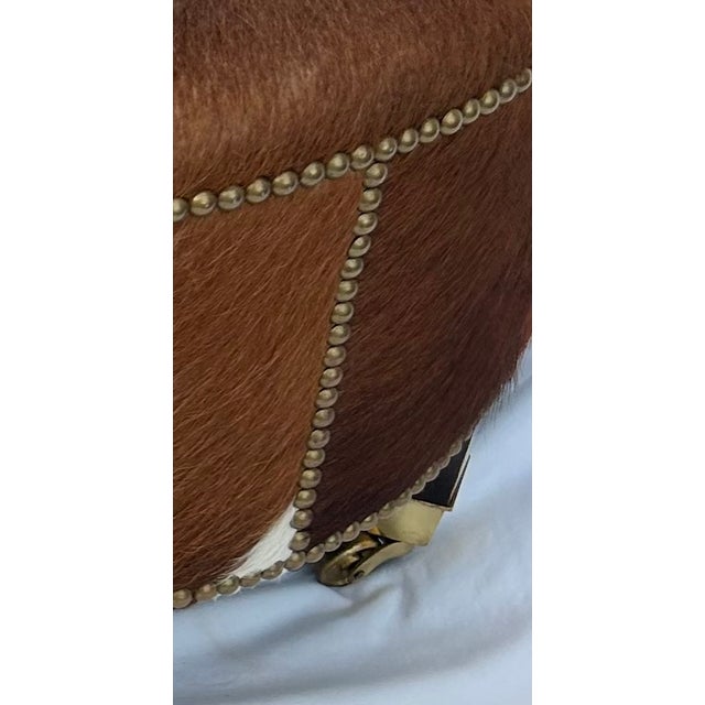 2000 - 2009 Vintage Cloverleaf Cowhide Ottoman With Brass Casters & Nailhead Trim For Sale - Image 5 of 7