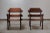 A pair of Brutalist solid wood armchairs. Crafted in rare Sipo/Utile mahogany. Belgium, circa 1960s. Sculpted arm chairs...