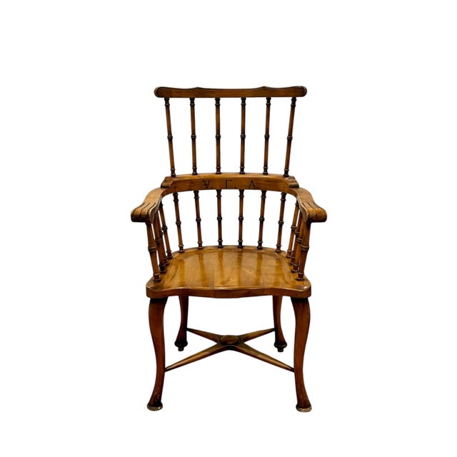 English Windsor Armchair, Circa 1870. This English Windsor armchair, circa 1870, is made of oak and features a comb-shaped...