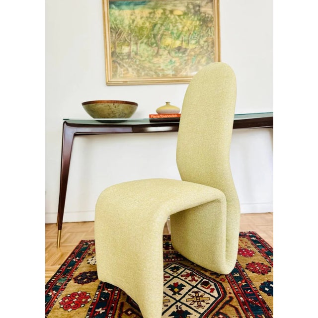 Original pair of Etcetera high back armchairs attributed to Jan Ekselius with his signature curved seat and back are newly...