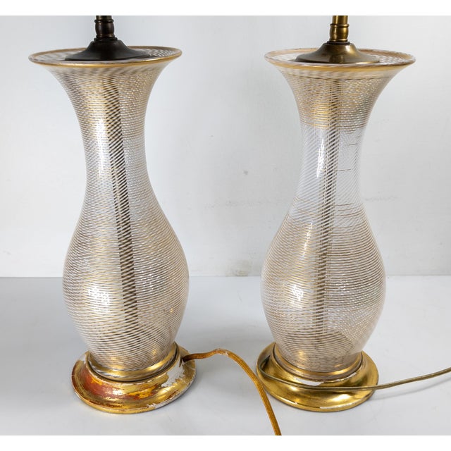 We are selling this gorgeous pair of Italian Murano glass lamps. These lamps have White and Clear latticinio decoration...