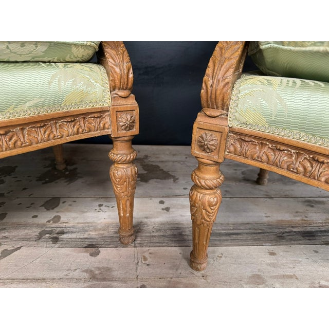 A very comfortable Pair of 19th Century French Bergere Chairs. The frames are Walnut and covered in delightful carved...