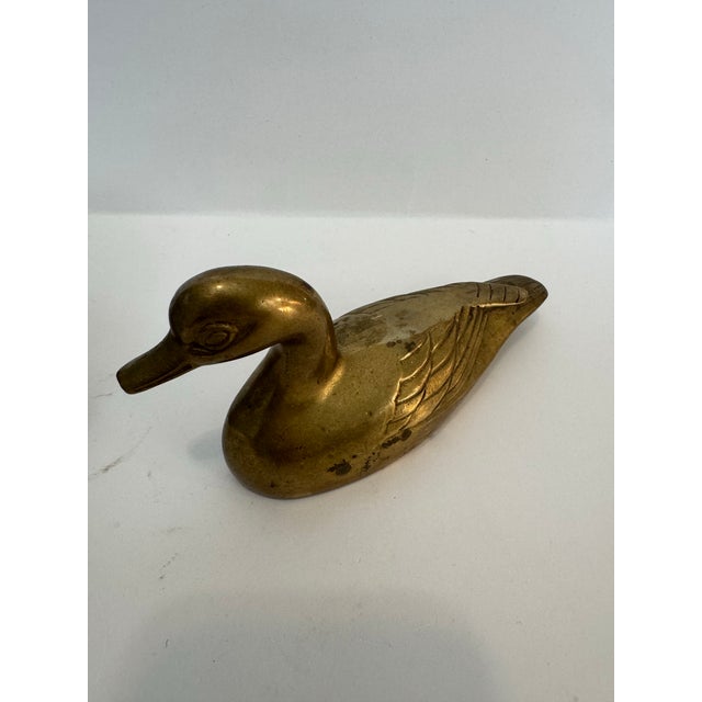 A charming pair of vintage solid brass animal studies, featuring an exceptionally detailed armadillo and a classic resting...