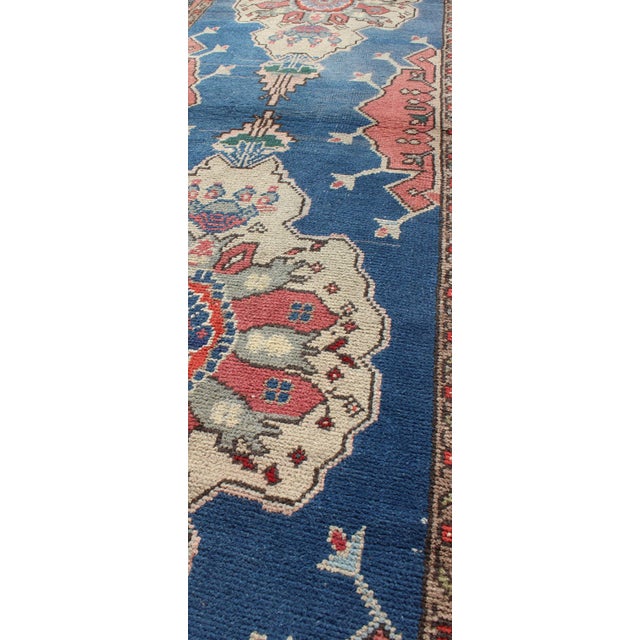 Mid 20th Century Grand Dual Medallion Oushak Vintage Runner From Turkey in Red and Blue For Sale - Image 5 of 9