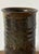 A sculptural vintage studio pottery vase with a tall cylindrical form and richly layered earth-tone glaze. Hand-thrown in...
