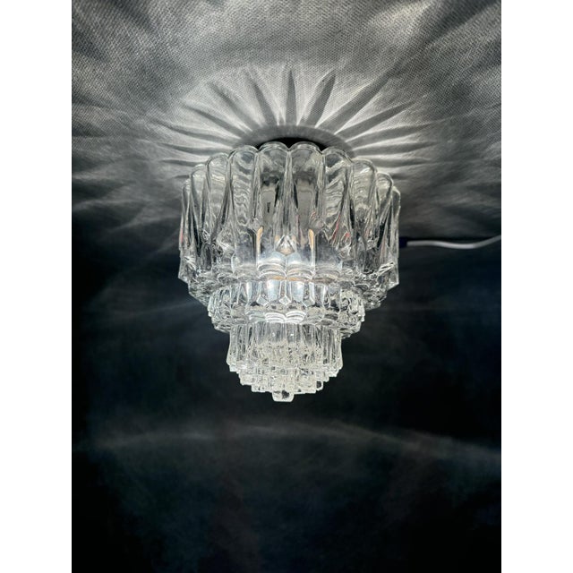 Striking 1970s flush mount made of thick textured glass with an organic ice-like pattern. The sculptural form beautifully...