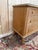 A 1960s double-bodied chest of drawers, featuring six drawers arranged in two columns of three, resting on tapered, turned...