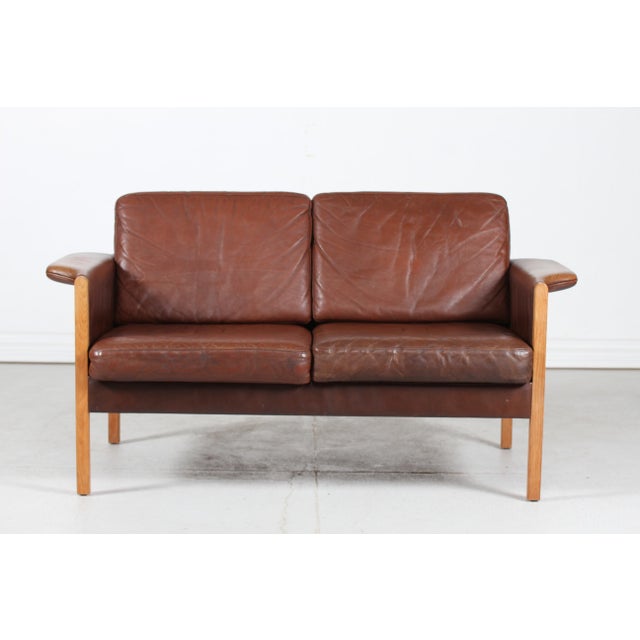 Danish vintage sofa for 2 persons in the style of Finn Juhl manufactured in Denmark in the 1970s. It's upholstered with...