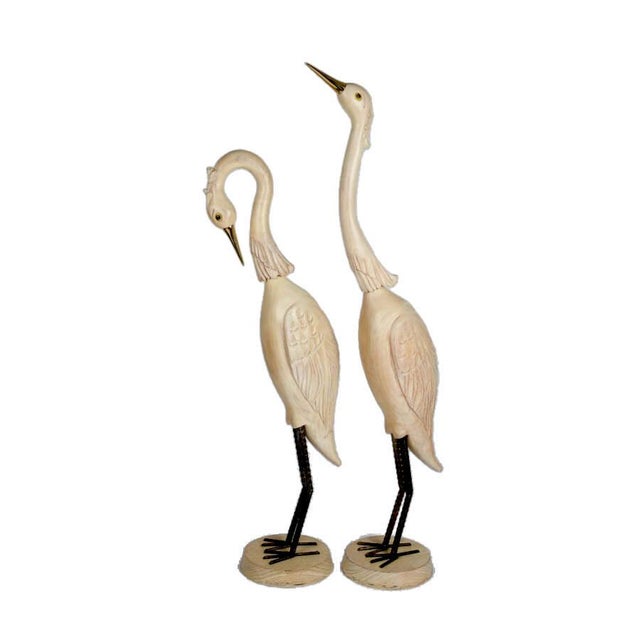 This pair of oversized carved wood crane sculptures offers an elegant and visually striking representation of one of...