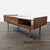 This West Elm coffee table features a sleek mid-century modern design with a walnut finish and elegant marble accent. The...
