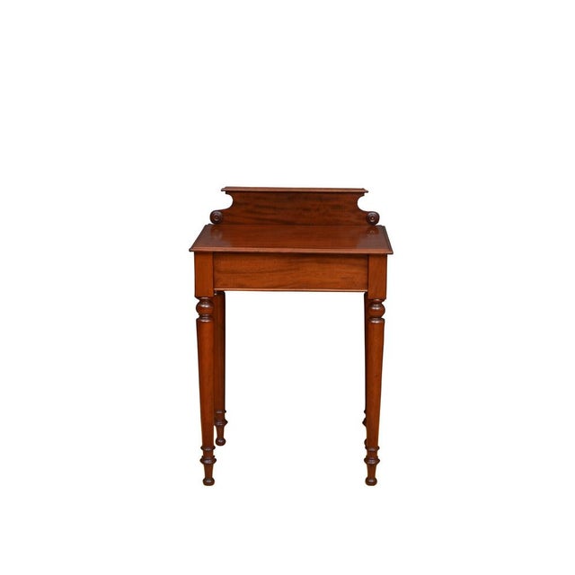 Elegant English, 19th century hall table in mahogany, having figured mahogany, shaped and moulded upstand to the back,...
