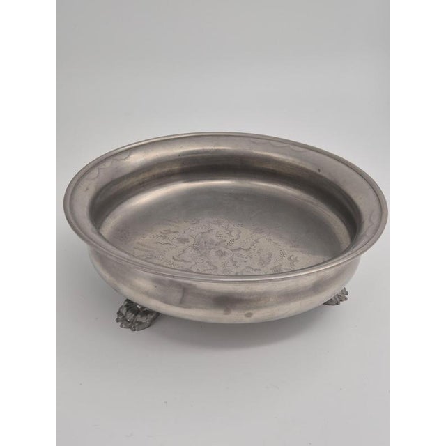 A beautiful solid pewter bowl with lion paws, decor of flowers and leafs. Designed by Anna Petrus and Estrid Ericson for...
