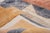 A composition of interlocking geometric shapes — navy blue, warm rust, dusty rose, and honeyed gold blocks arranged with...