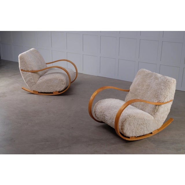 Reupholstered in sheepskin. Produced in Sweden, 1950s.