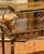 Make a sophisticated statement with this French Louis XVI-inspired serving table, crafted in wood with an elegant polished...