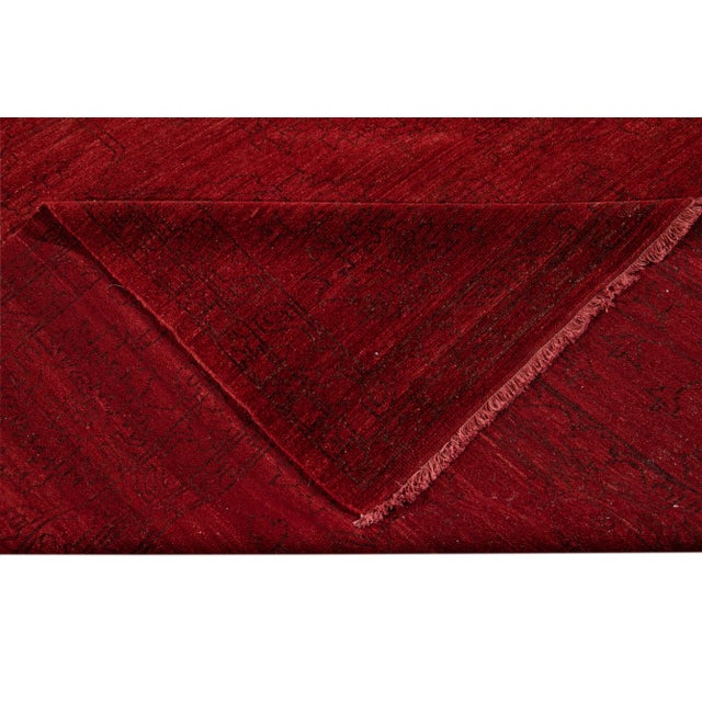 Beautiful Modern Indian Geometric Rug with a red field. This pieces has black accents with an all over design. This rug...