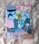8.5" x 11" A mixed-media collage featuring the post-punk new wave band the B-52's, adorned in a maximalist style with...