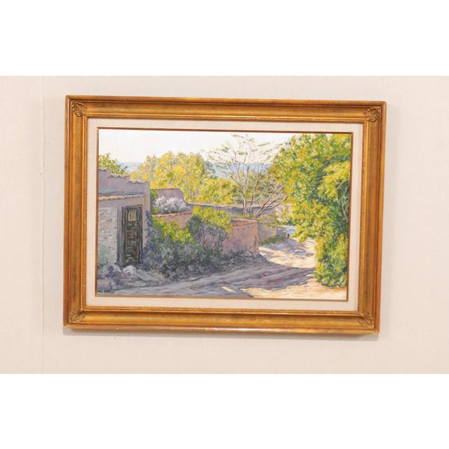 A medium sized oil painting by American artist Paul B. Wilson. This lovely painting depicts a Spanish Colonial style...