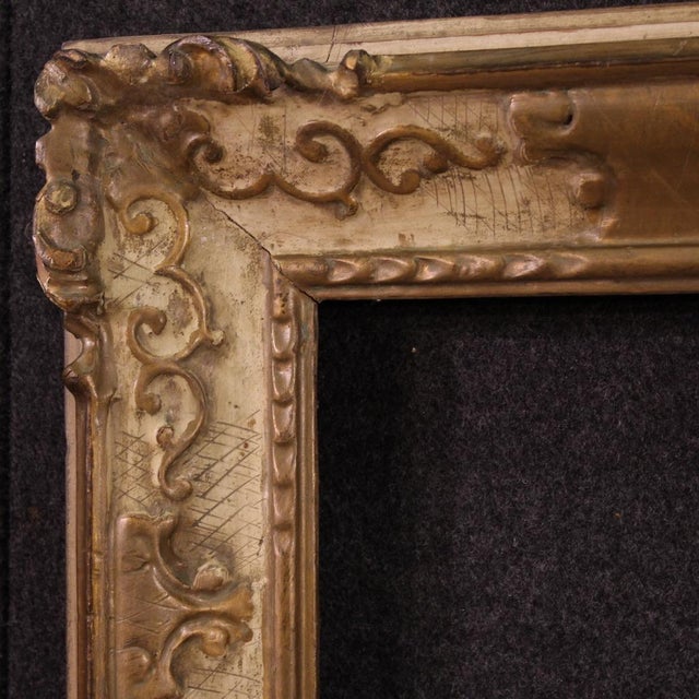 Mid-20th-century Italian frame. Carved, lacquered, and gilded wood of good size and quality. The frame can hold a painting...
