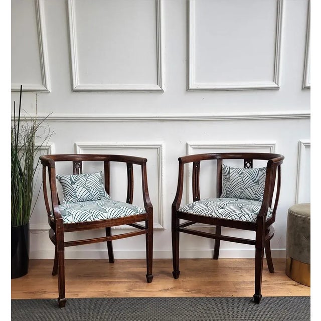 A beautiful and sleek pair of Italian wooden side chairs of fine quality with excellent profile carvings and detail...