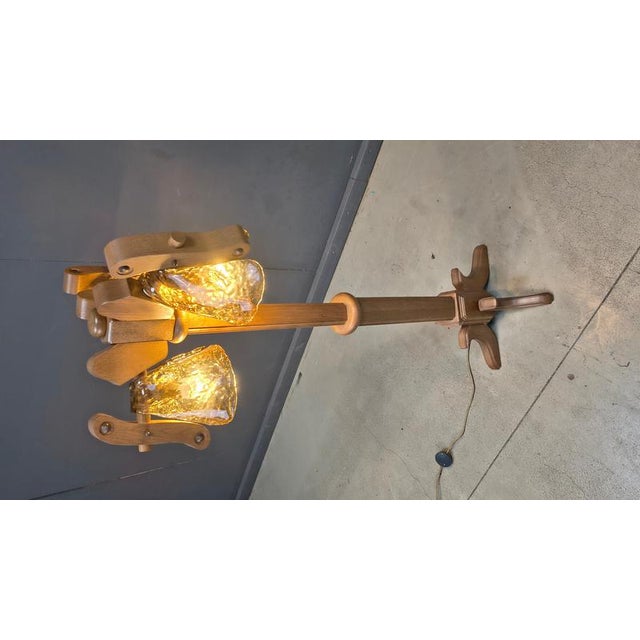 Vintage german floor lamp made from a nice oak base and hand blown murano shades cleverly hung from the arms. Beauitfully...