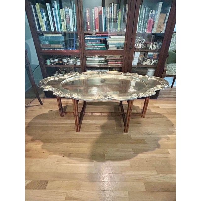 There are so many things to say about this coffee table. The massive brass tray top ( it lifts off of the base ) is 55”...