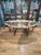 There are so many things to say about this coffee table. The massive brass tray top ( it lifts off of the base ) is 55”...