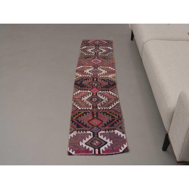 Vintage Hand-Knotted area rug is a semi-antique vintage runner rug. The '70s Eastern region of Anatolia's unique rug is...