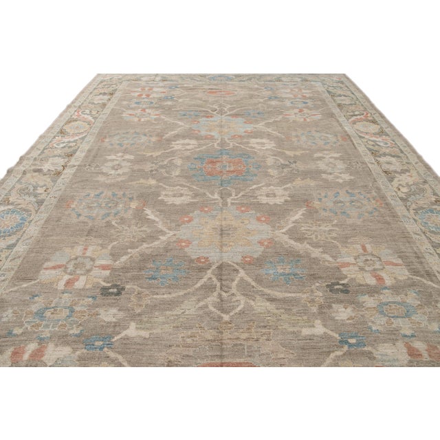 Beautiful modern Sultanabad oversize hand-knotted wool rug with a light brown field. This Sultanabad rug has a gray frame...