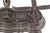 An antique French iron and brass balance scale with a decorative iron base bearing the name Breveté S.D.D.G. with raised...
