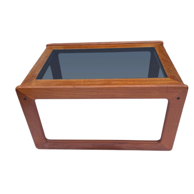 Mid Century Danish teak and smoked glass side or cocktail table by Komfort of Denmark. The teak has been well cared for...