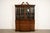 A gorgeous Georgian or Chippendale style lighted breakfront bookcase or dining cabinet with drop front secretary desk By...