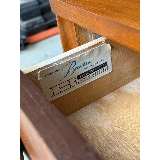 Vintage mid century modern broyhill Brasilia lowboy dresser with mirror. Gorgeous walnut grain. Piece was previously...
