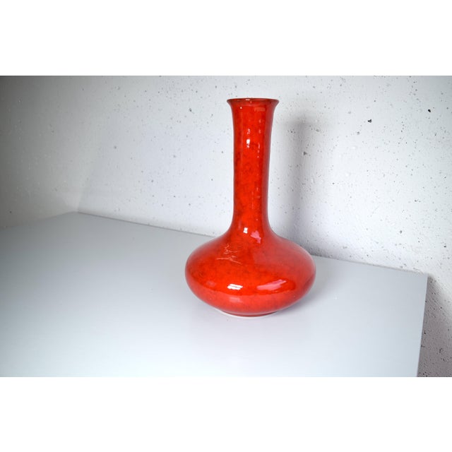 This is a beautifully shaped ceramic vase from the 1960s, made by Scheurich. The vase was manufactured in West Germany....