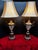 Exceptional and highly distinctive pair of French Neoclassical/Empire-style urn-form table lamps featuring substantial...