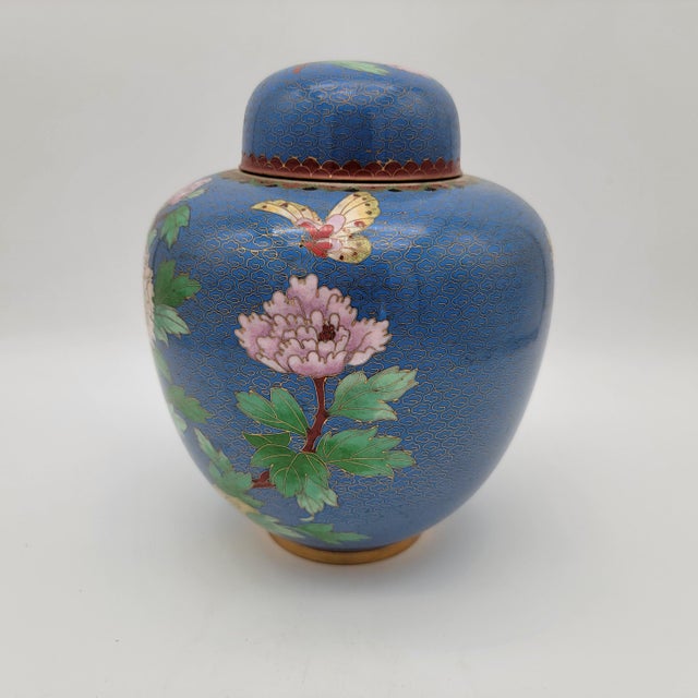 Enhance your home decor with this vintage cloisonné ginger jar, featuring intricate floral designs on a rich blue...