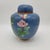 Enhance your home decor with this vintage cloisonné ginger jar, featuring intricate floral designs on a rich blue...