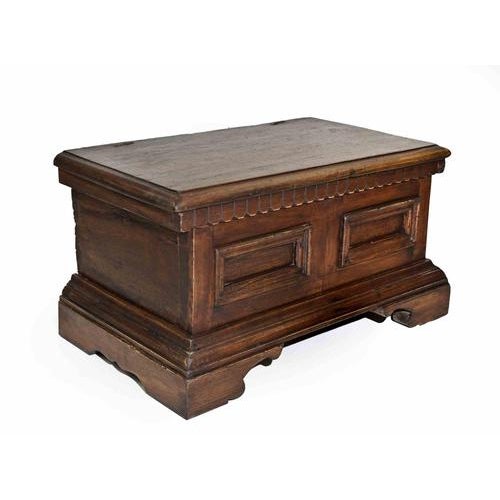 A robust and characterful wooden coffer of rectangular form, raised on a molded plinth base with shaped apron. The façade...