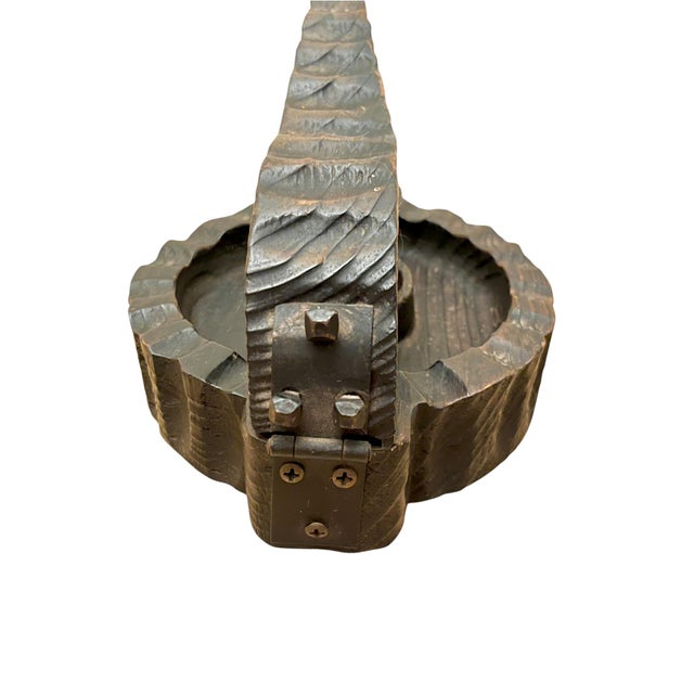 A wonderfully sculptural vintage wood nutcracker with a beautifully worn, hand-hewn character. The rustic carved form...