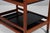Børge Mogensen tray table with frame of mahogany. Plates of black laminate. with cutting board etc. Mounted on wheels....