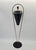 An elegant Mid-Century Modern standing ashtray from the 1960s/70s. Its minimalist, sculptural form is characteristic of...