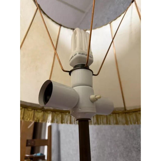 Very large gilt bronze candlestick mounted as a lamp (wired to current standards) / 192 cm high Wooden base Animal-shaped...