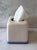 Vintage ivory ceramic square tissue box cover featuring rounded corners and a blue and trim around the base.