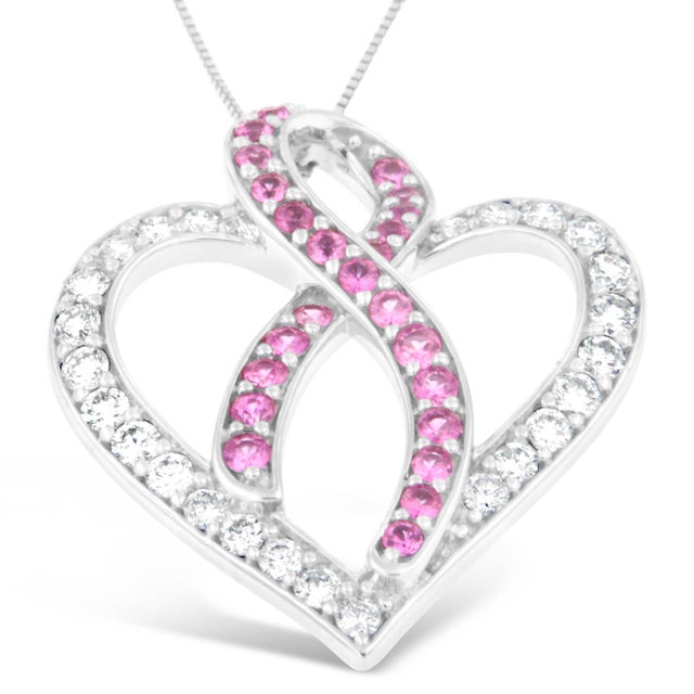This romantic yet radiant necklace is suspended from 14 karats white gold. It is formed in the shape of an interwoven...
