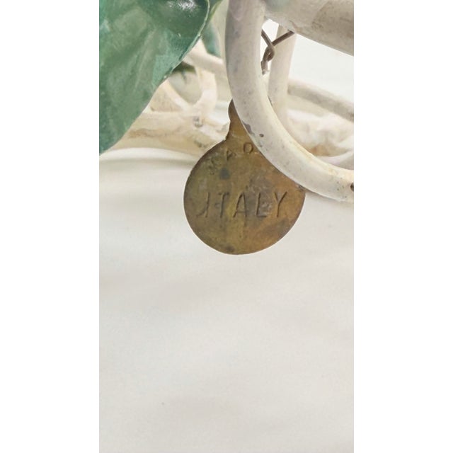 A rare vintage Italian tole candelabra, hand-crafted in the mid-century tradition and signed with the original brass “Made...