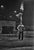 S V Parkin's Circus Acrobats An acrobat performs a handstand on one arm, which balances on the head of an accordionist,...